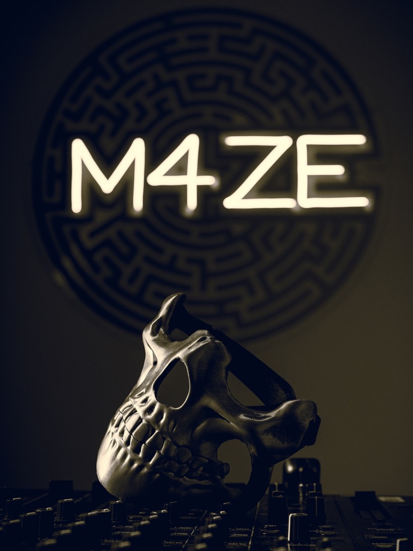Skull mask resting on a mixer in front of a neon M4ZE sign